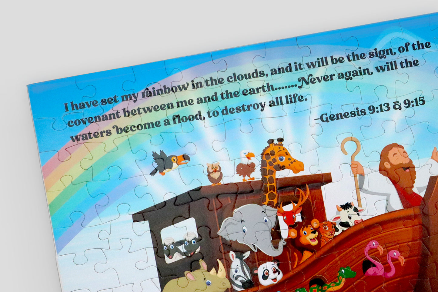 Close up of the Noah's Ark Puzzle corner that features bible scripture of Genesis 9:13 and Genesis 9:15 which tells of the meaning of the rainbow in the story of Noah's Ark. I Sow Brilliant